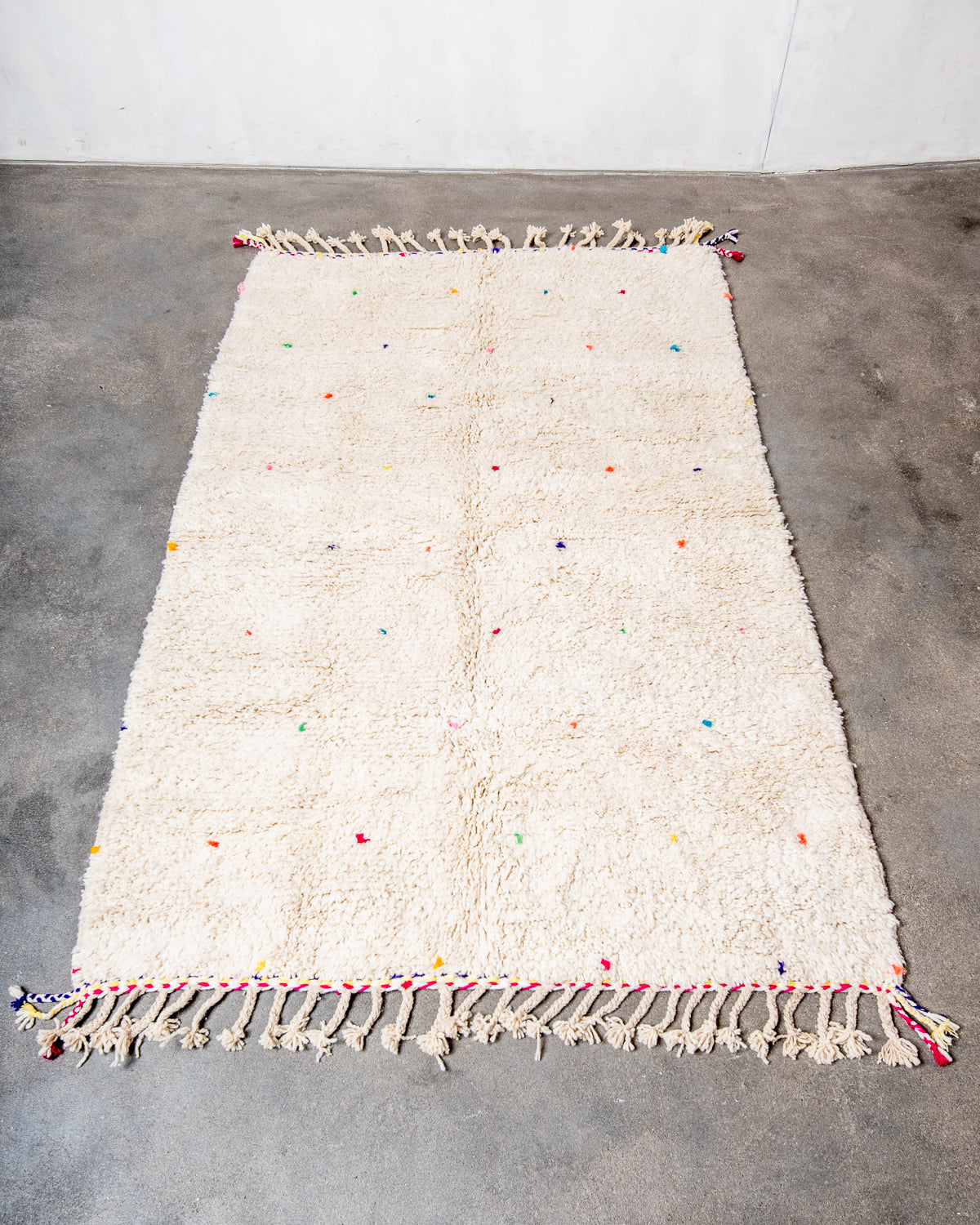 Modern, designer, handcrafted Berber rug from Morocco. Beniourain carpet with beautiful colours and patterns and fluffy wool texture.